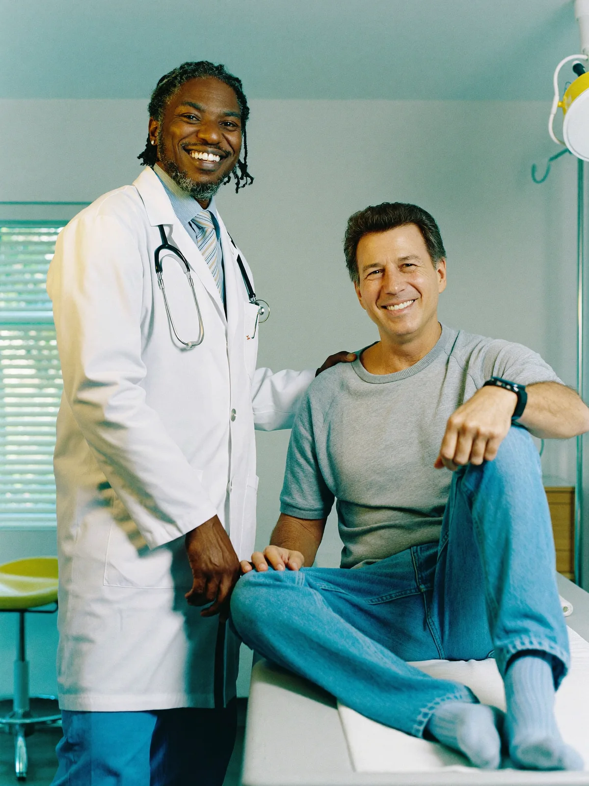 Orthopedic doctor with a smiling patient at German Medical Center, Dubai Healthcare City