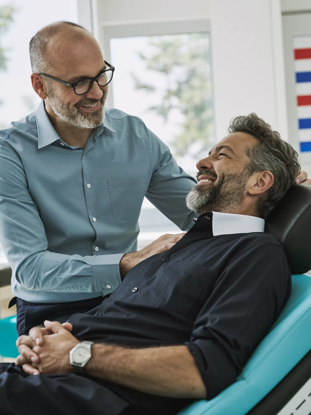 A urologist warmly reassuring a patient at German Medical Center, Dubai Healthcare City